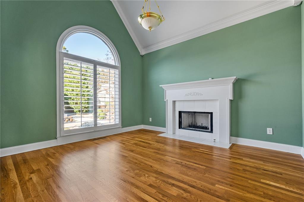 2013 Cockrell Run Northwest Kennesaw, GA 30152 - Photo 10 of 69 a view of empty room with wooden floor and fireplace