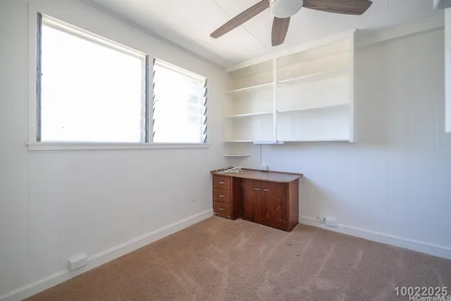 a room with a cabinet and a window