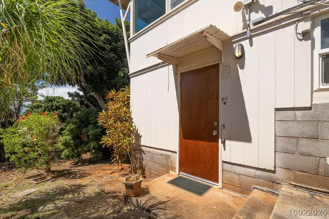 a view of a house with a tree