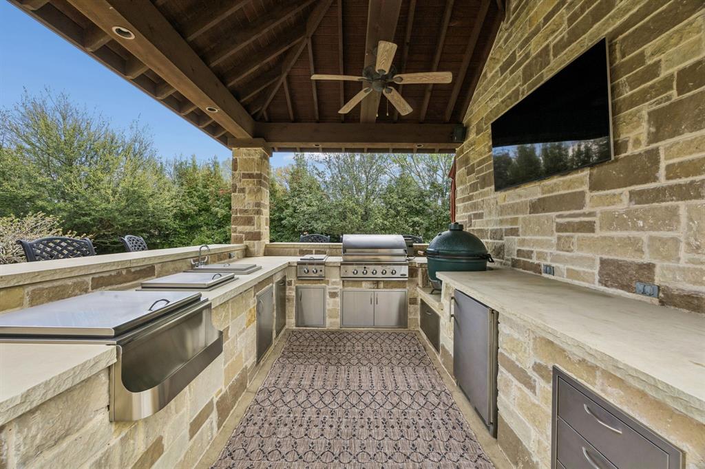 1005 Berkshire Road Southlake, TX 76092 - Photo 19 of 40 a kitchen with a sink a counter top space and stainless steel appliances