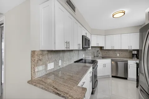 a bathroom with a shower and a toilet