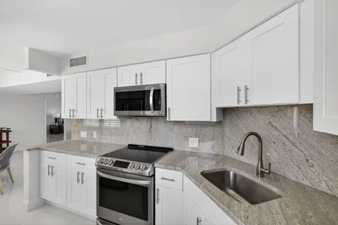 a bedroom with a large bed and a large window