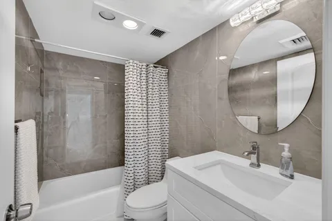 a view of a city with a building in the background