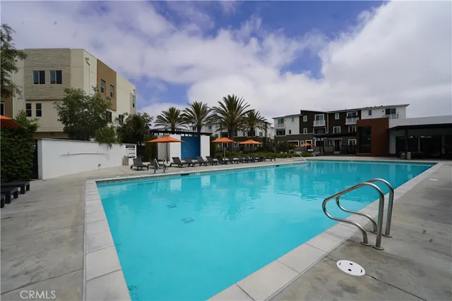 a view of a patio with a dining table and chairs with wooden floor and lake view