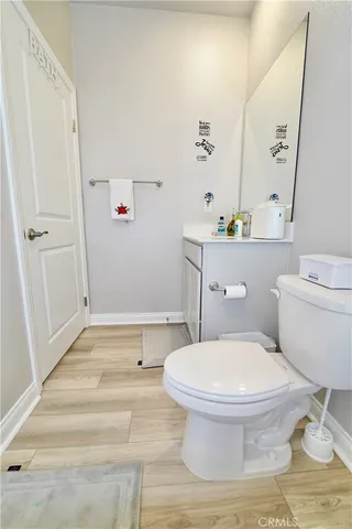 a bathroom with a toilet and a sink