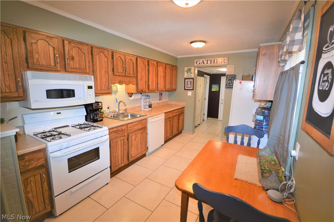 1967 Benjamin Road Madison, OH 44057 - Photo 4 of 15 Ceramic tile looks so great with the neutral décor, and ample counter and cupboards!!