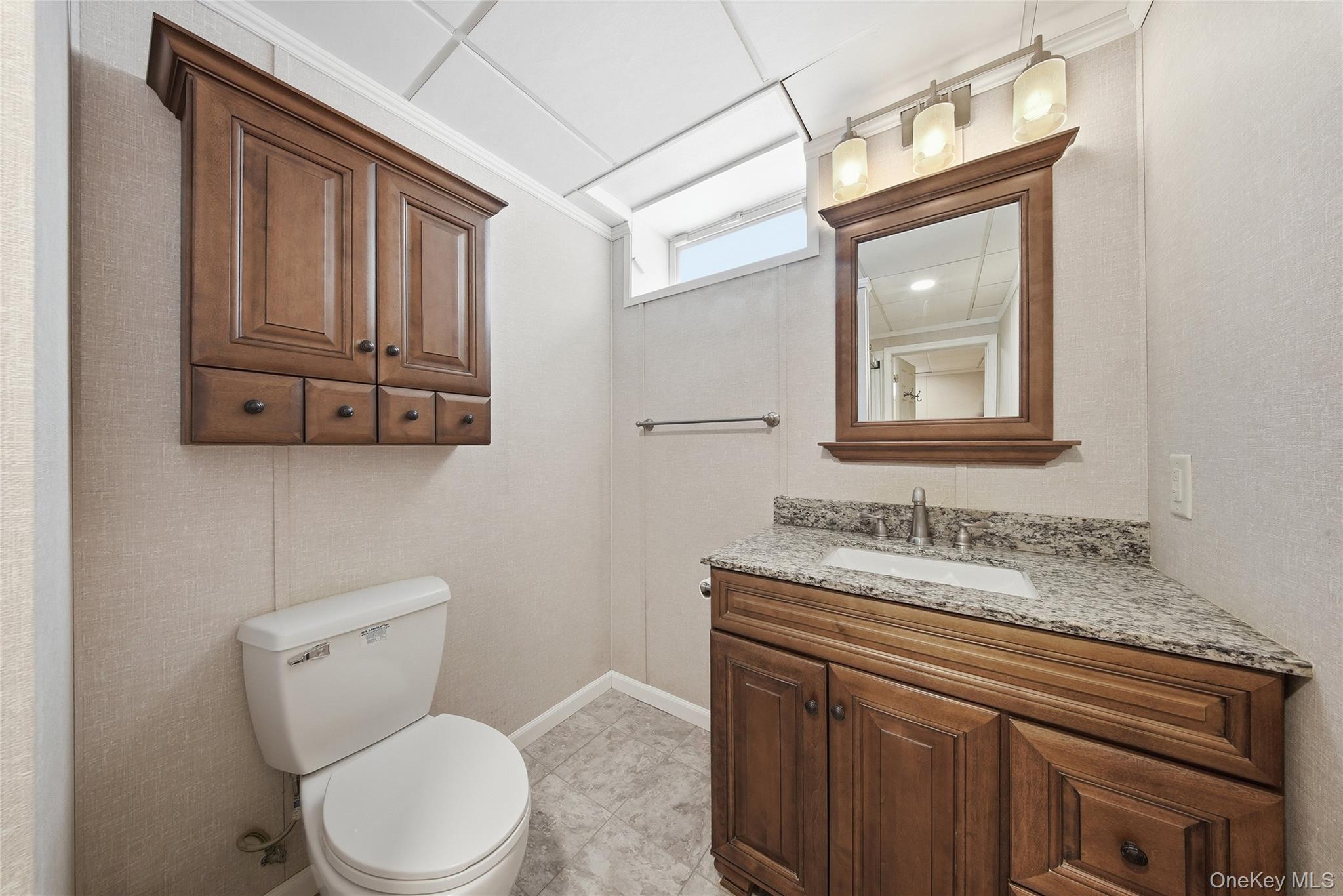 38 Rose Road Woodbourne, NY 12788 - Photo 15 of 35 a bathroom with a toilet sink and mirror
