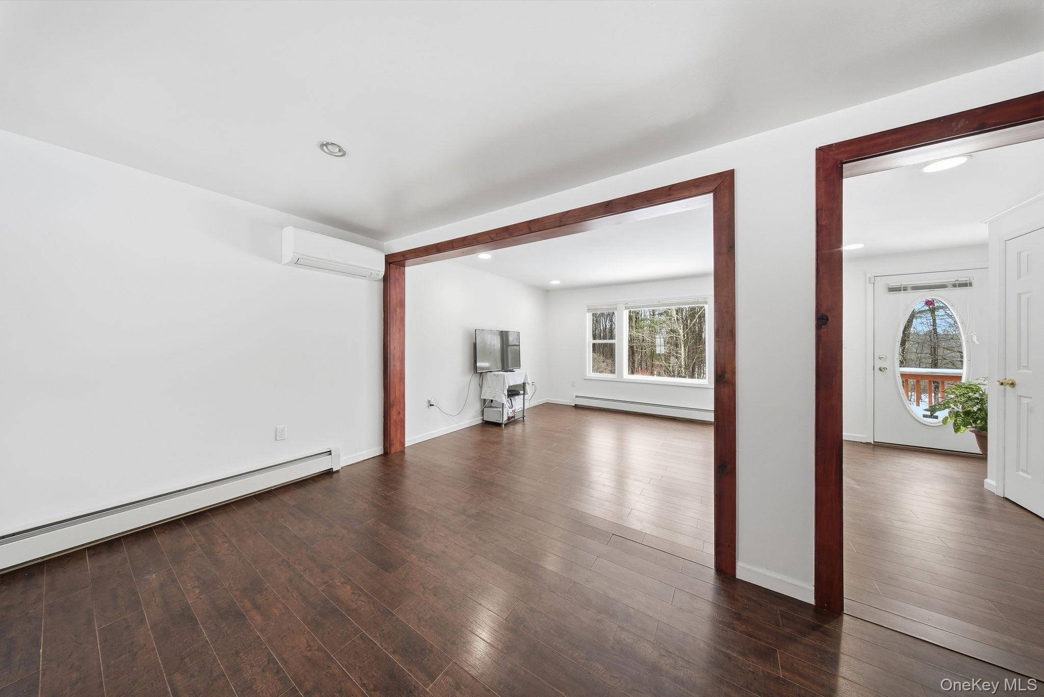 38 Rose Road Woodbourne, NY 12788 - Photo 8 of 35 a view of an empty room with wooden floor and a window