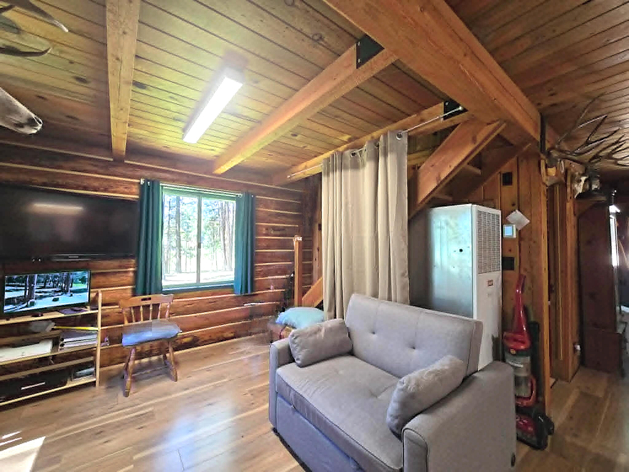 836 Ulrich Road Prospect, OR 97536 - Photo 20 of 47 a living room with furniture and a flat screen tv