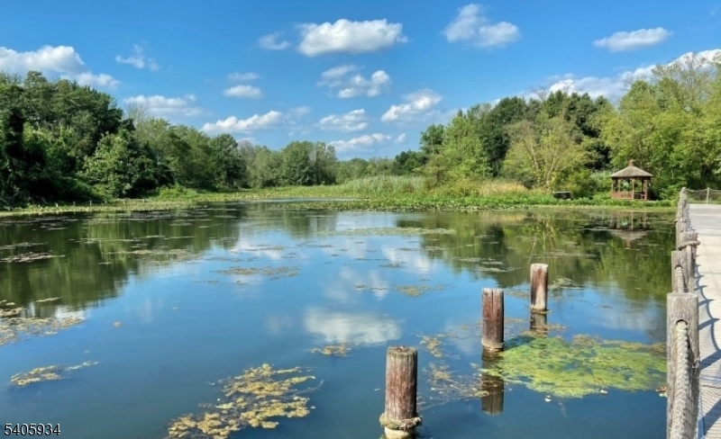 8-13 Maple Crescent, Unit 12 Vernon, NJ 07462 - Photo 14 of 18 a view of a lake from a yard
