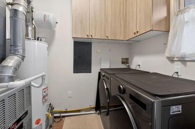 a kitchen with a sink a stove and cabinets