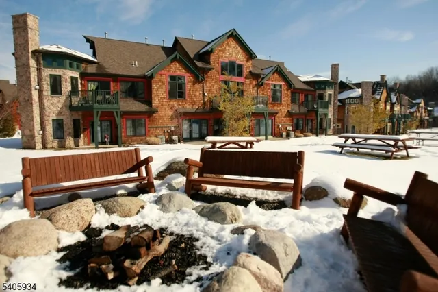 a front view of a house with a yard outdoor seating and kitchen view