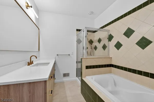 a bathroom with a bathtub and a sink