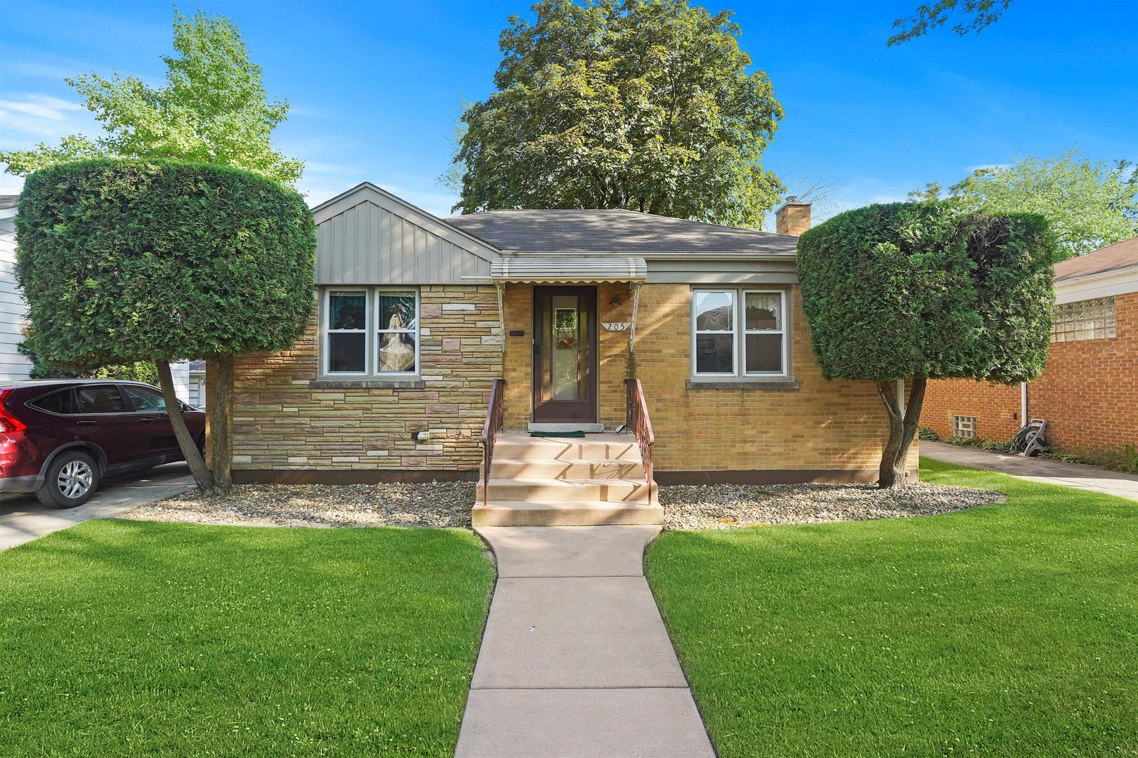 205 East Burlington Street Riverside, IL 60546 - Photo 1 of 19 a front view of a house with a yard