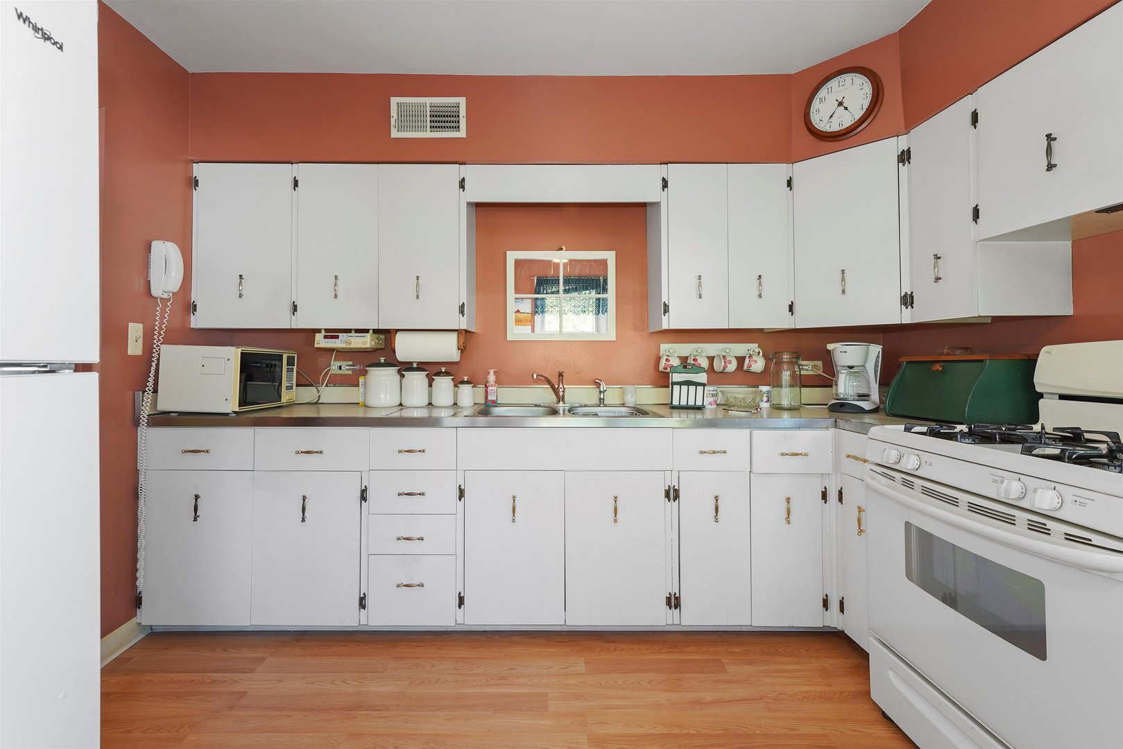 205 East Burlington Street Riverside, IL 60546 - Photo 11 of 19 a kitchen with granite countertop white cabinets and white appliances