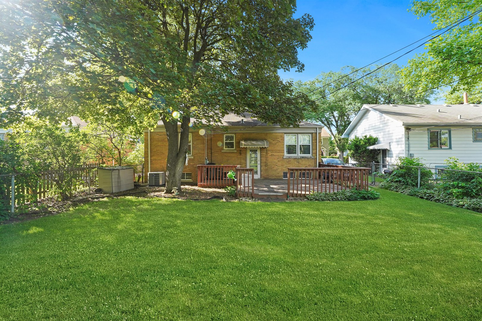 205 East Burlington Street Riverside, IL 60546 - Photo 18 of 19 a view of a house with backyard sitting area and garden