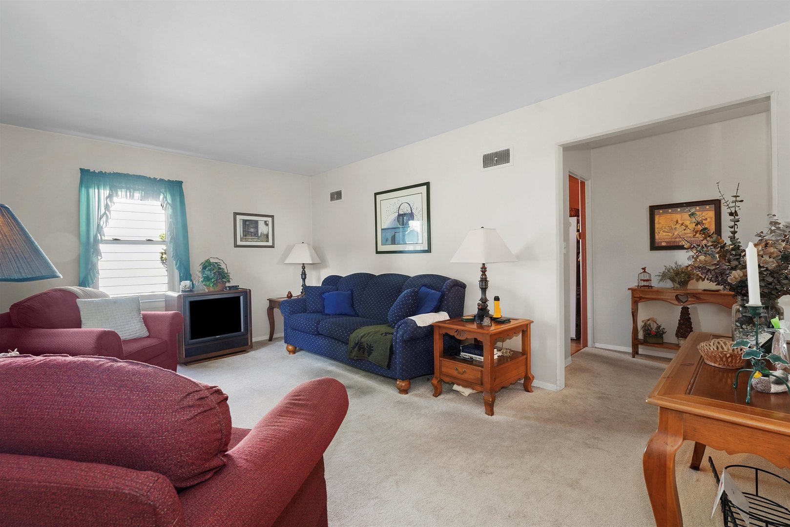 205 East Burlington Street Riverside, IL 60546 - Photo 3 of 19 a living room with furniture a couch and a window