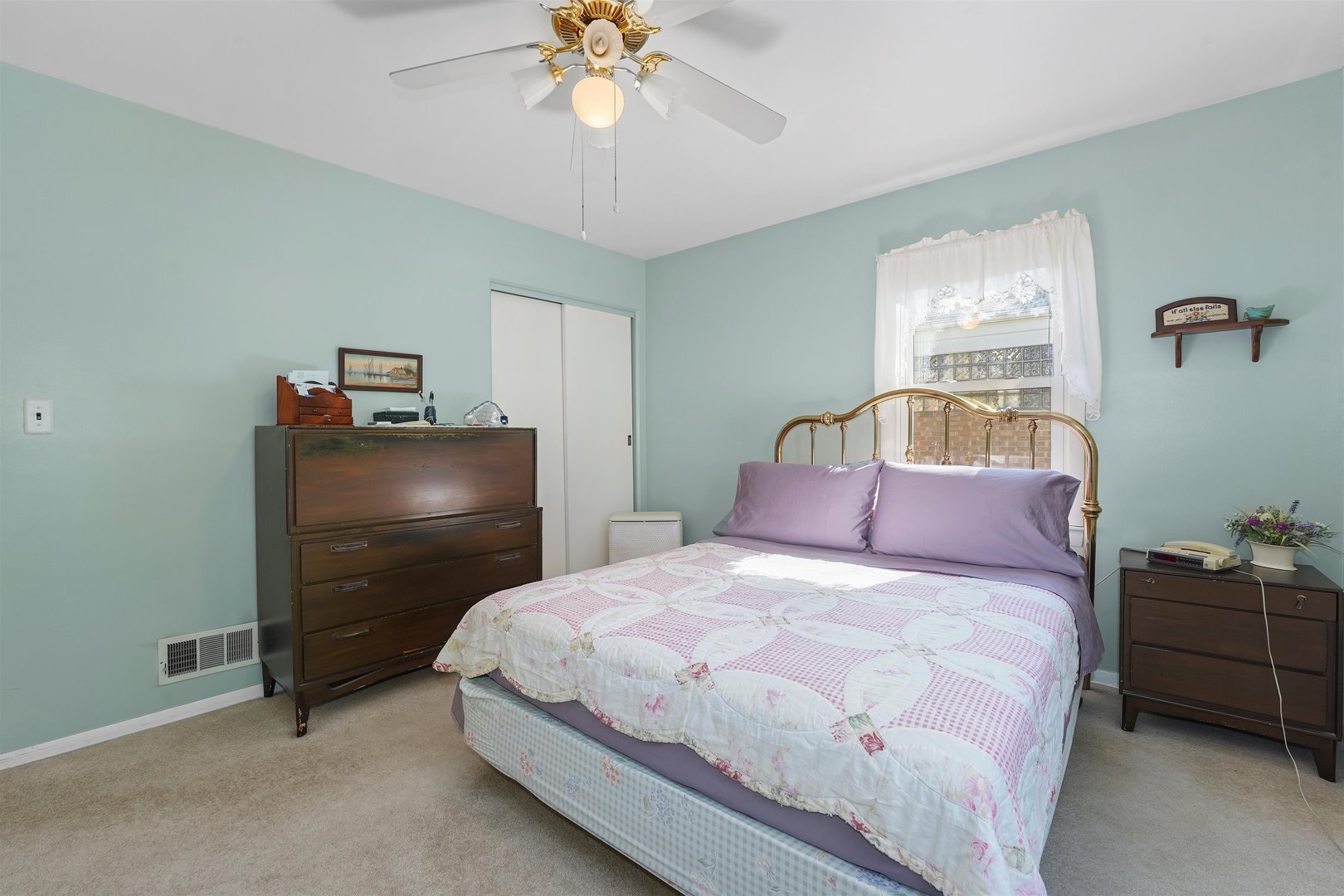205 East Burlington Street Riverside, IL 60546 - Photo 5 of 19 a bedroom with a bed and a chandelier