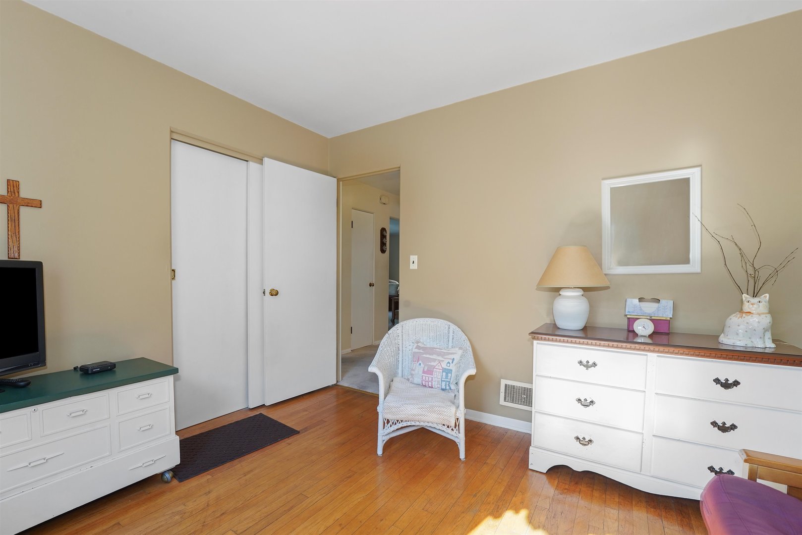 205 East Burlington Street Riverside, IL 60546 - Photo 7 of 19 a bedroom with a bed and a dresser in it