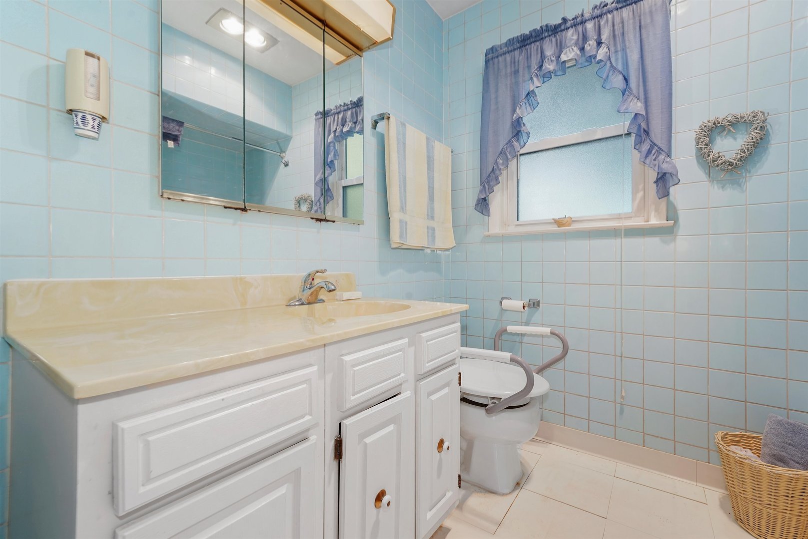 205 East Burlington Street Riverside, IL 60546 - Photo 8 of 19 a bathroom with a granite countertop toilet sink and mirror