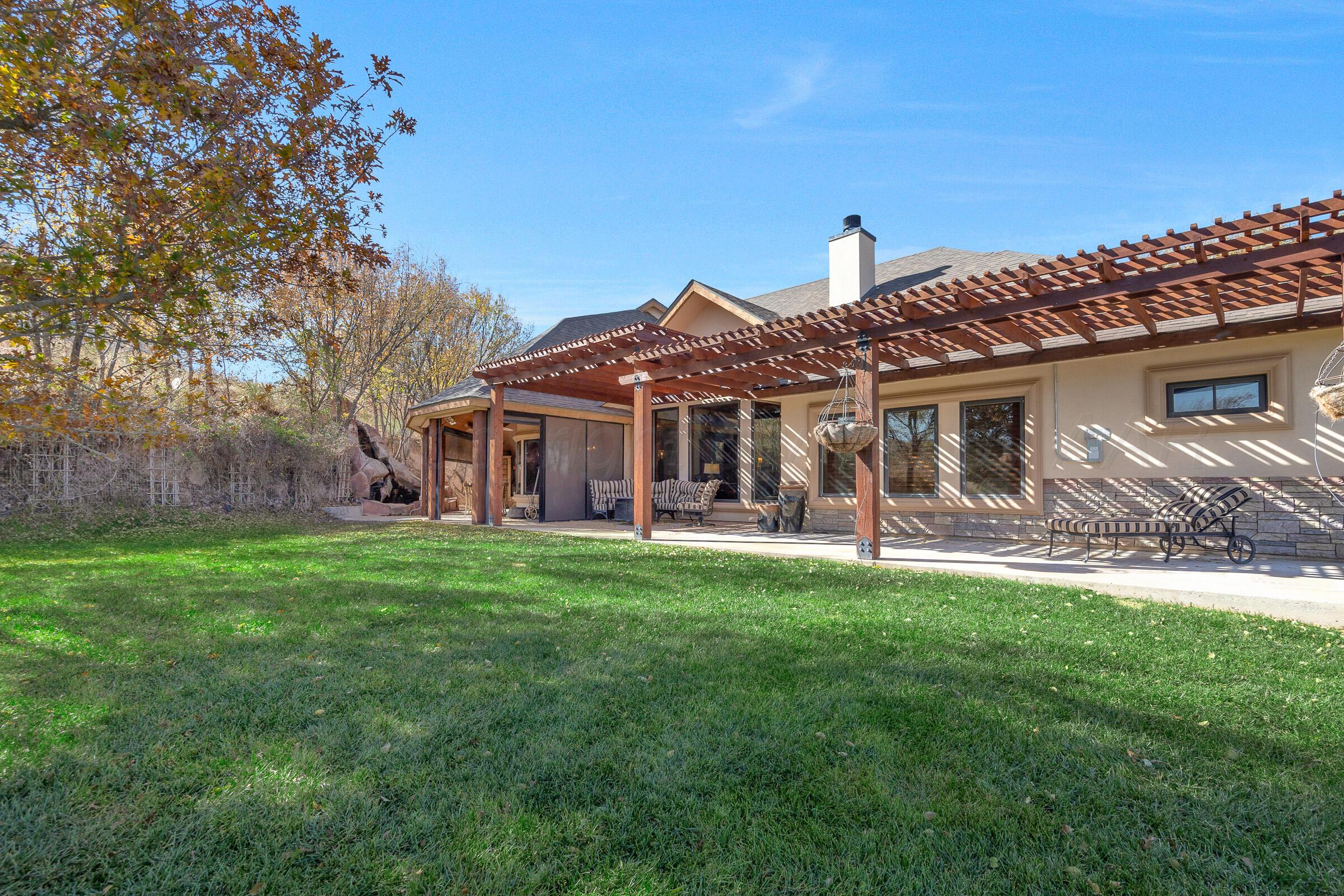 19551 Chaparral Road Canyon, TX 79015 - Photo 37 of 42 a front view of a house with a yard porch and furniture