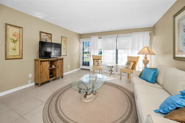 a kitchen with granite countertop a sink stainless steel appliances and cabinets