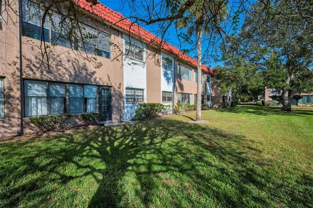 a view of a lake with a house in the background