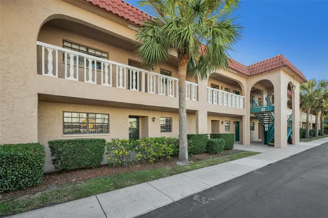 an aerial view of a house with a yard and garden