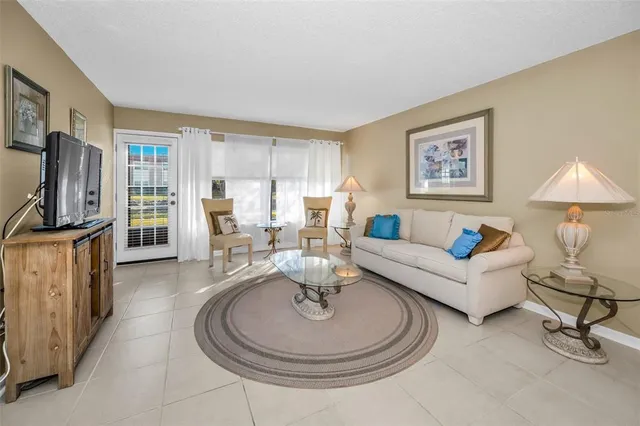 a kitchen with granite countertop cabinets stainless steel appliances and a counter space