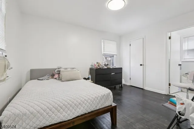 a bedroom with a bed and a table