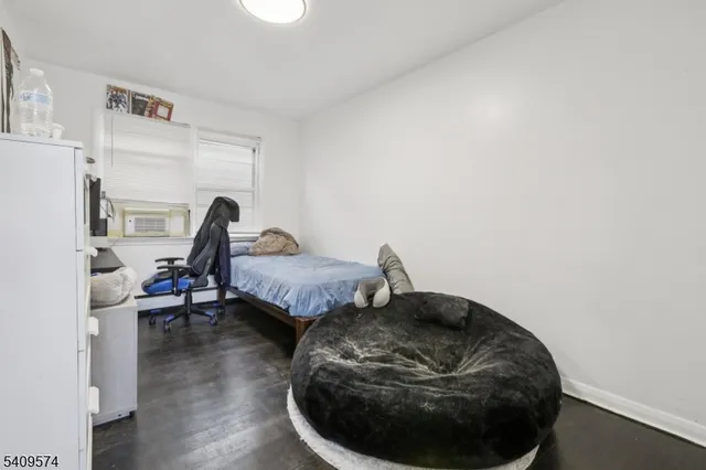 a bed room with a bed and a window