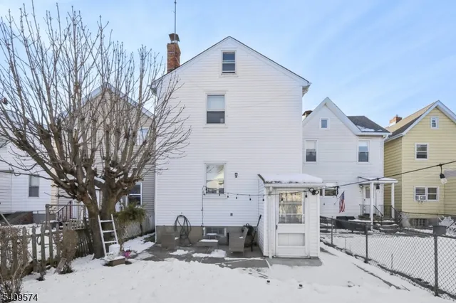 a view of a house with a snow in the yard