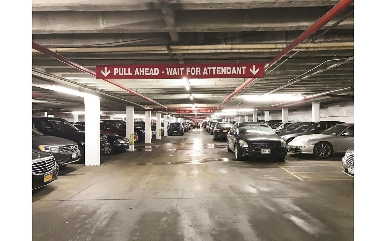 410 West 24th Street, Unit 15D Manhattan, NY 10011 - Photo 13 of 35 a view of a garage with cars