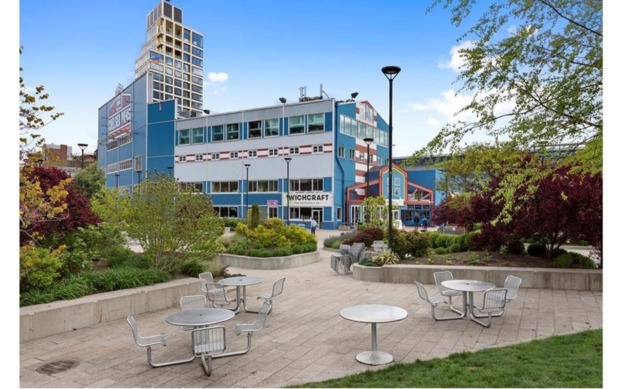 410 West 24th Street, Unit 15D Manhattan, NY 10011 - Photo 30 of 35 a view of a patio with table and chairs and potted plants