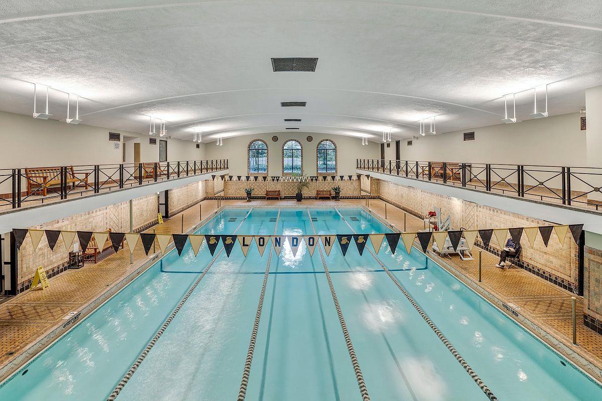 410 West 24th Street, Unit 15D Manhattan, NY 10011 - Photo 9 of 35 a living room with lots of furniture and a large window