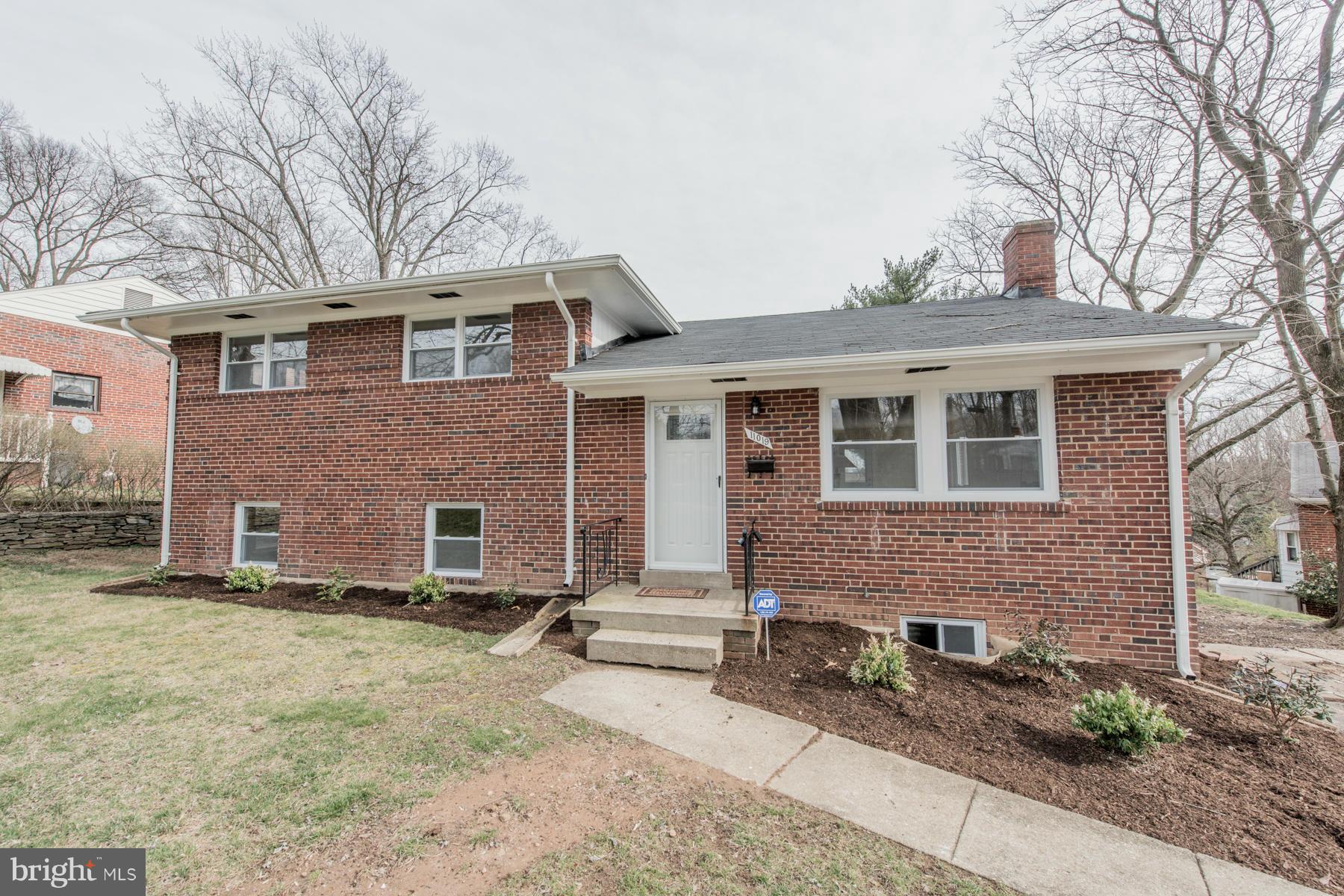 11019 Oakwood Street Silver Spring, MD 20901 - Photo 2 of 30 a front view of a house with garden