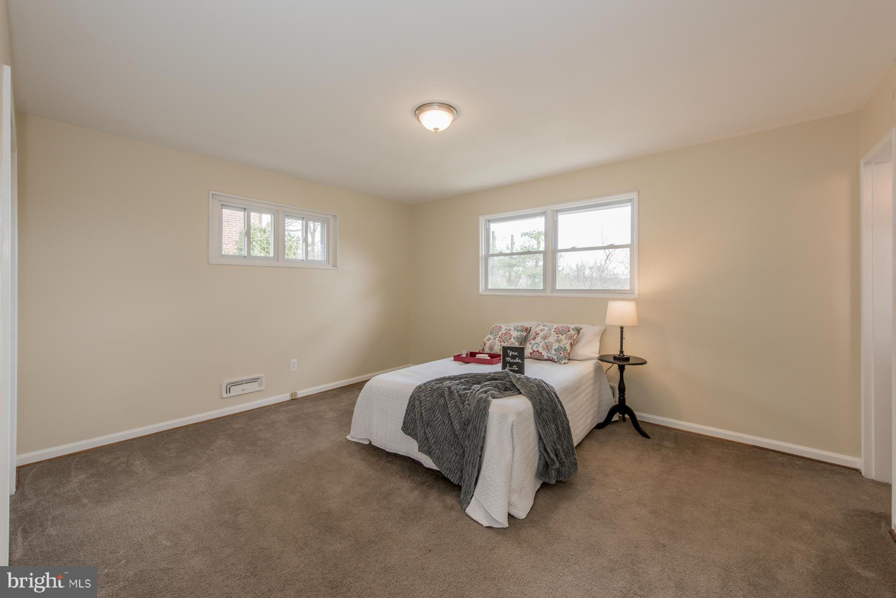 11019 Oakwood Street Silver Spring, MD 20901 - Photo 14 of 30 a bed room with a bed and a window