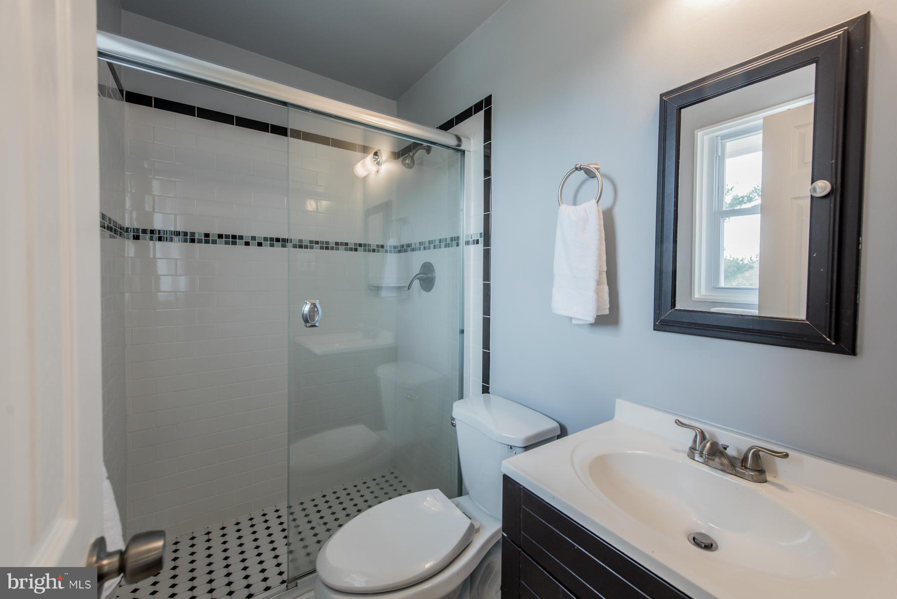 11019 Oakwood Street Silver Spring, MD 20901 - Photo 17 of 30 a bathroom with a sink toilet and shower
