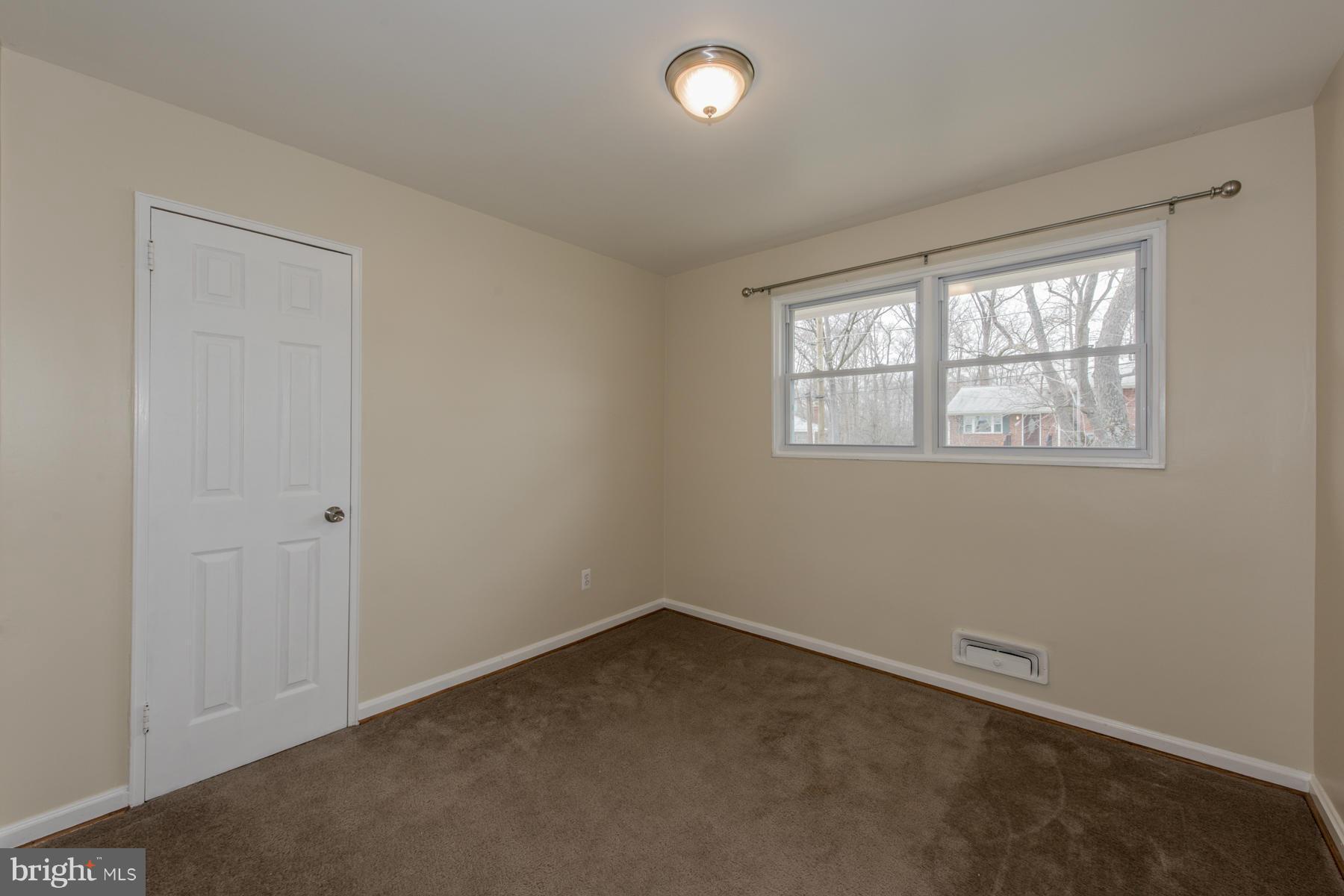 11019 Oakwood Street Silver Spring, MD 20901 - Photo 21 of 30 an empty room with a window