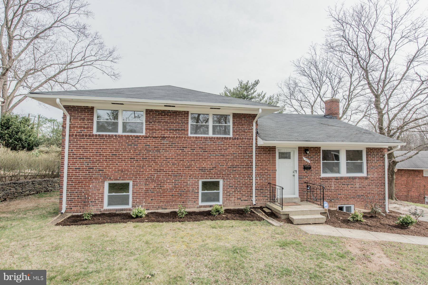 11019 Oakwood Street Silver Spring, MD 20901 - Photo 29 of 30 a front view of a house with a yard