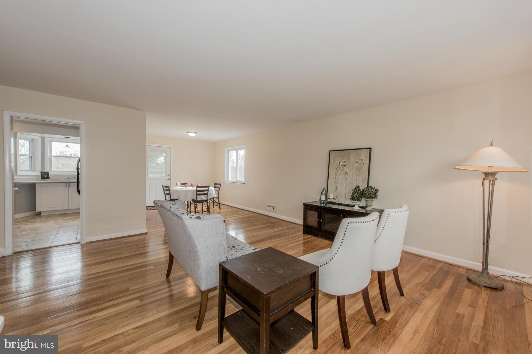 11019 Oakwood Street Silver Spring, MD 20901 - Photo 5 of 30 a dining room with furniture and wooden floor