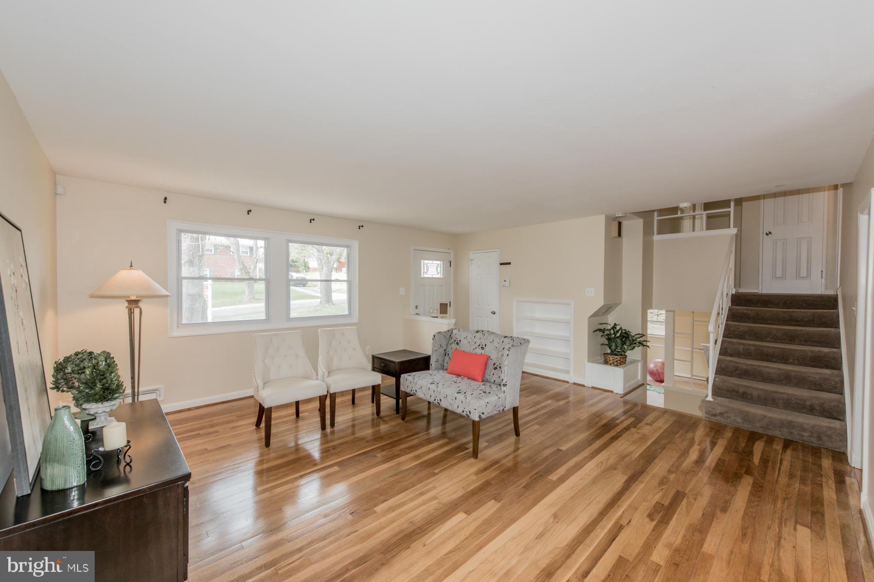 11019 Oakwood Street Silver Spring, MD 20901 - Photo 6 of 30 a living room with furniture and wooden floor