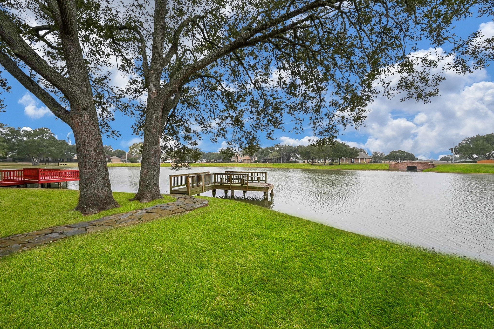 a view of a lake with houses in the back