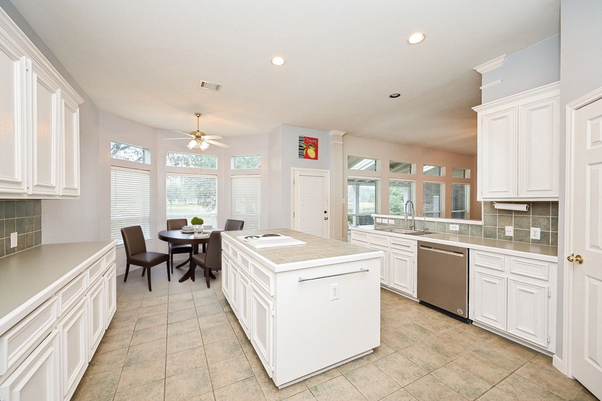 18 Crest Gate Houston, TX 77082 - Photo 14 of 46 a large white kitchen with a large window