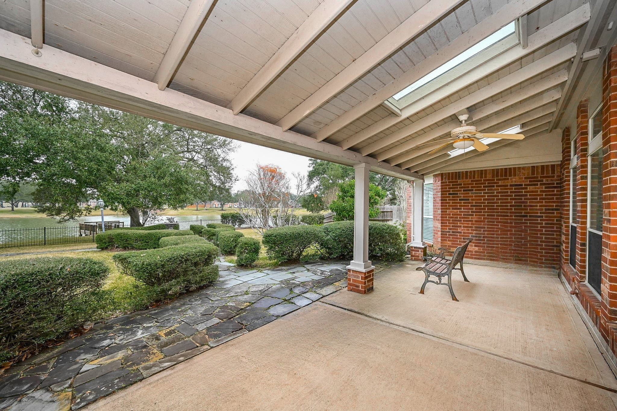 18 Crest Gate Houston, TX 77082 - Photo 18 of 46 a view of a patio with a table chairs and a backyard