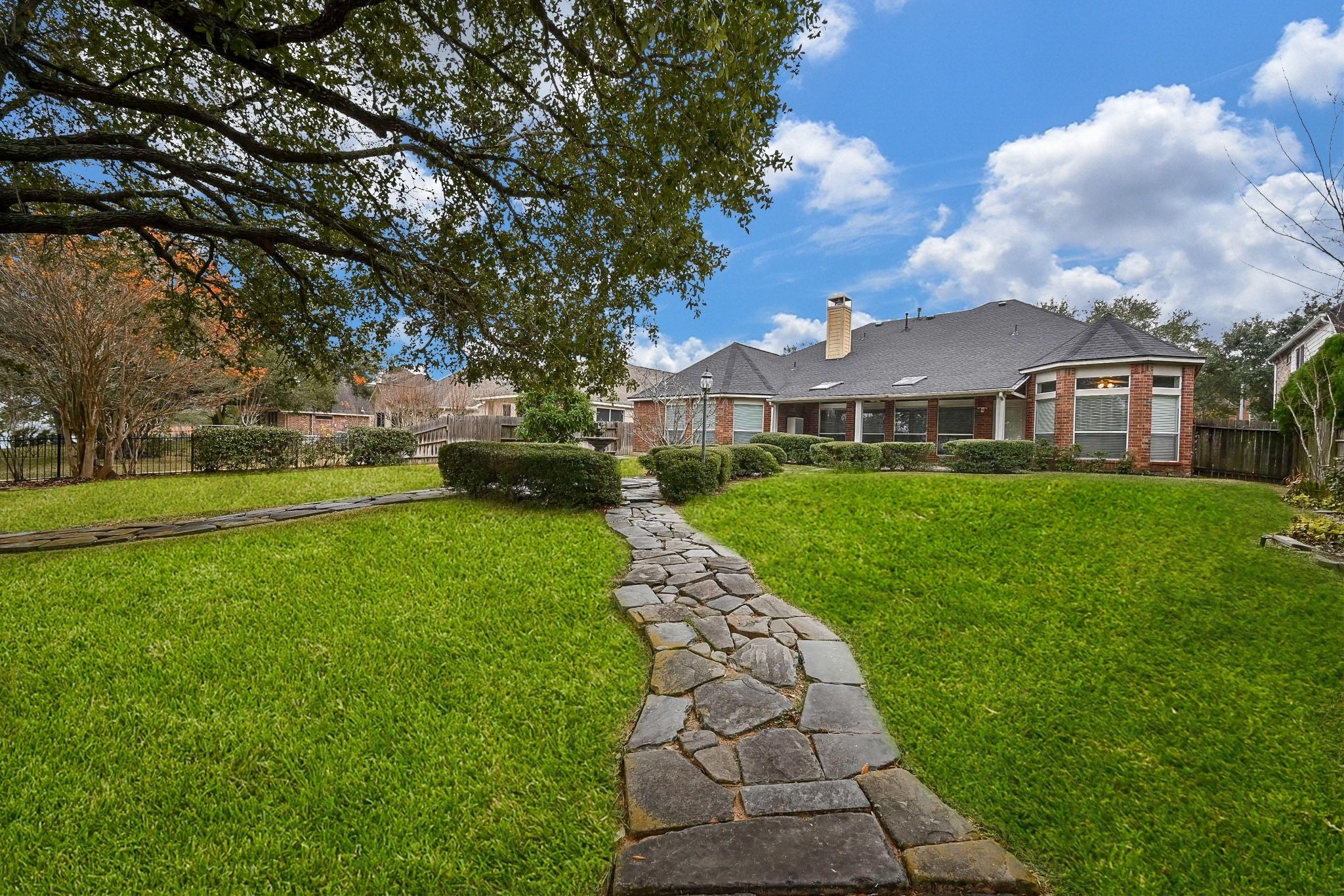 18 Crest Gate Houston, TX 77082 - Photo 20 of 46 a view of yard with swimming pool and green space