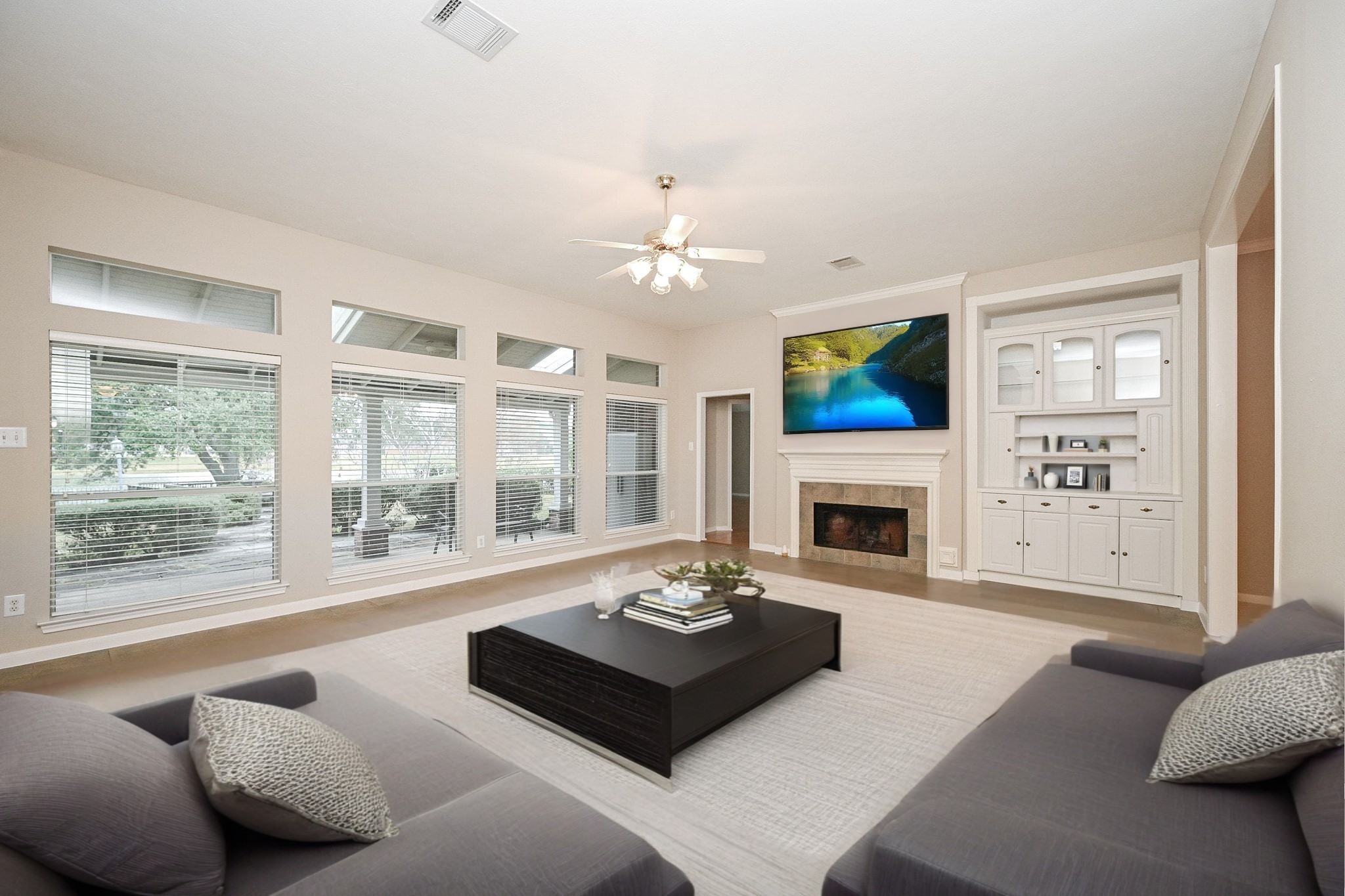 18 Crest Gate Houston, TX 77082 - Photo 3 of 46 a living room with furniture a fireplace and a large window