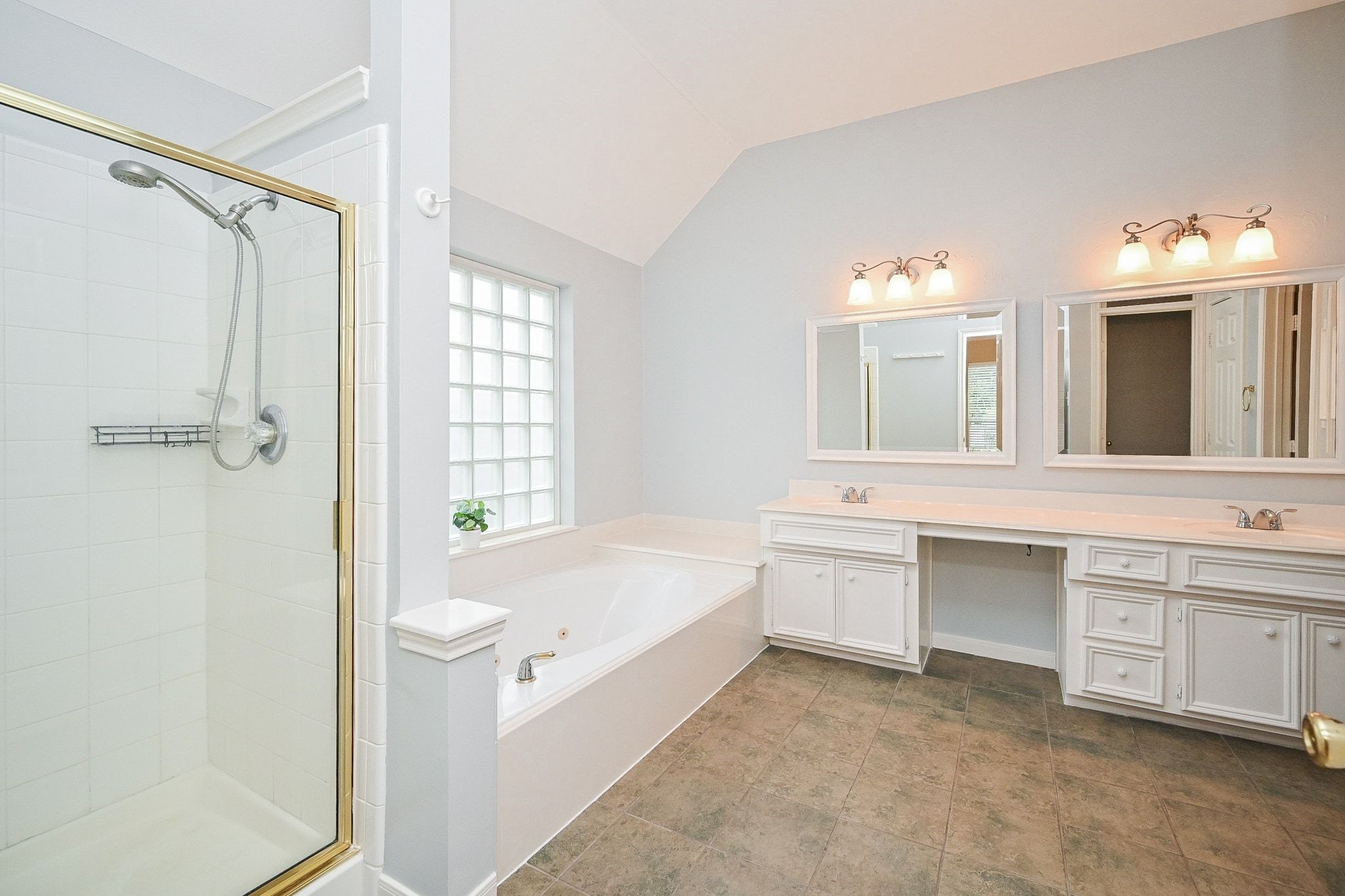 18 Crest Gate Houston, TX 77082 - Photo 7 of 46 a bathroom with a tub sink shower and mirror