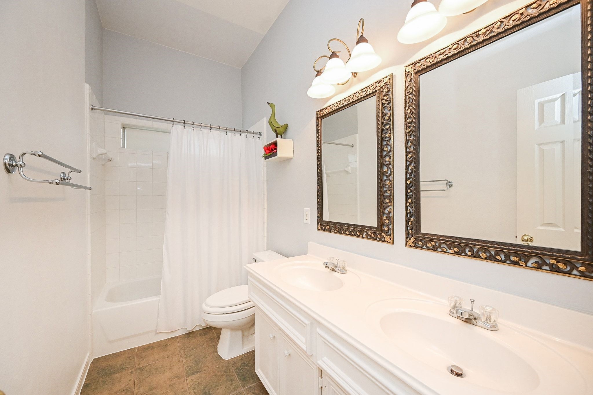 18 Crest Gate Houston, TX 77082 - Photo 9 of 46 a bathroom with a sink a toilet and shower
