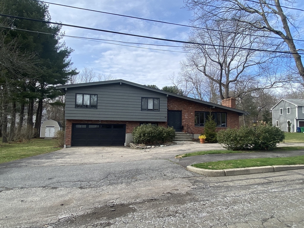 44 Marla Circle Newton, MA 02459 - Photo 1 of 23 a front view of a house with a yard
